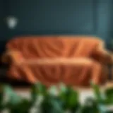 Elegant leather couch adorned with a stylish sofa cover