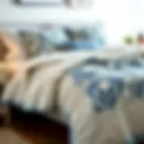 Elegant blue and white quilt displayed on a neatly made bed