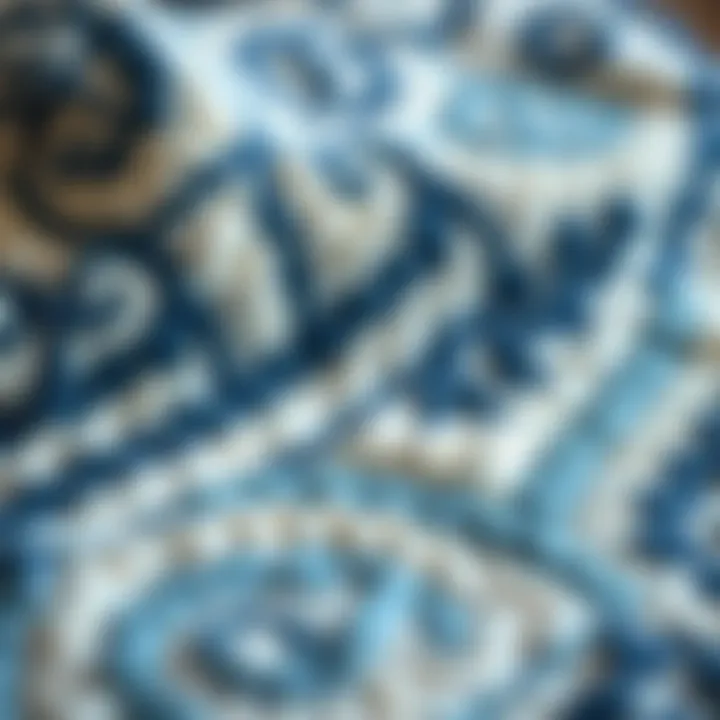Close-up of intricate patterns on a blue and white quilt