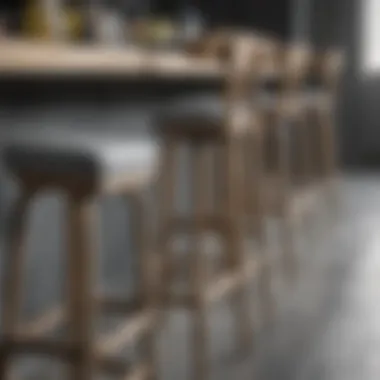 Close-up of the craftsmanship of grey wooden bar stools with backs