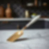 Elegant offset icing spatula on a marble countertop
