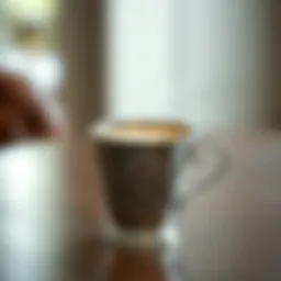 Elegant metal frothing cup with intricate design