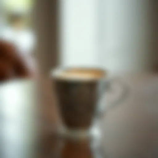 Elegant metal frothing cup with intricate design