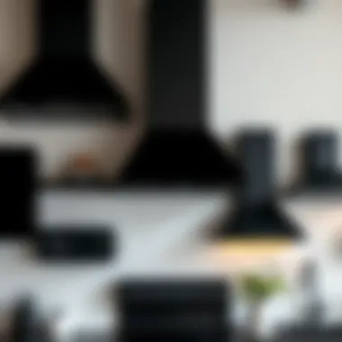 Various styles of black kitchen hoods displayed together