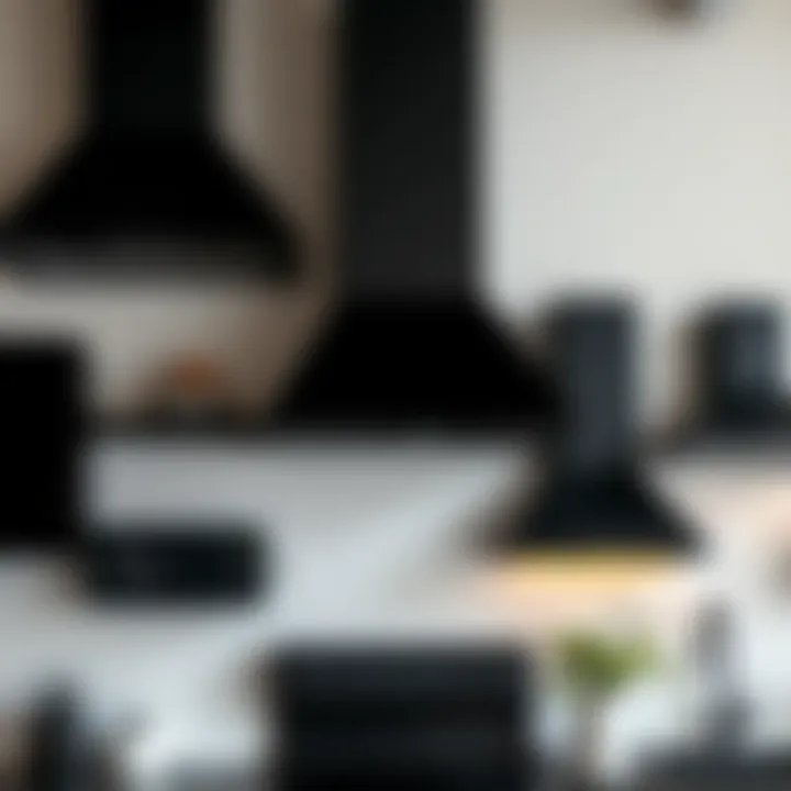 Various styles of black kitchen hoods displayed together